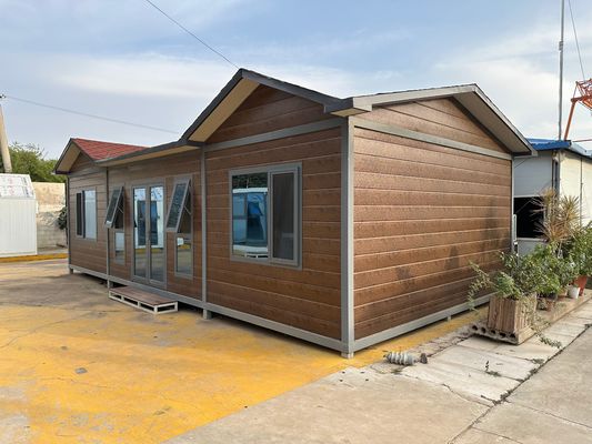 다기능 전문 공급 40ft 빠른 설치 모듈형 평면 포장 컨테이너 하우스 높은 바람 등급 Prefab 가정 사무실 컨테이너
